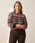 Folk Fair Isle Sweater — worn by a model against a warm off-white studio backdrop