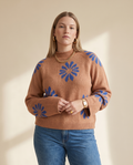 Daisy Knit Sweater — worn by a model against a soft oat-beige studio backdrop