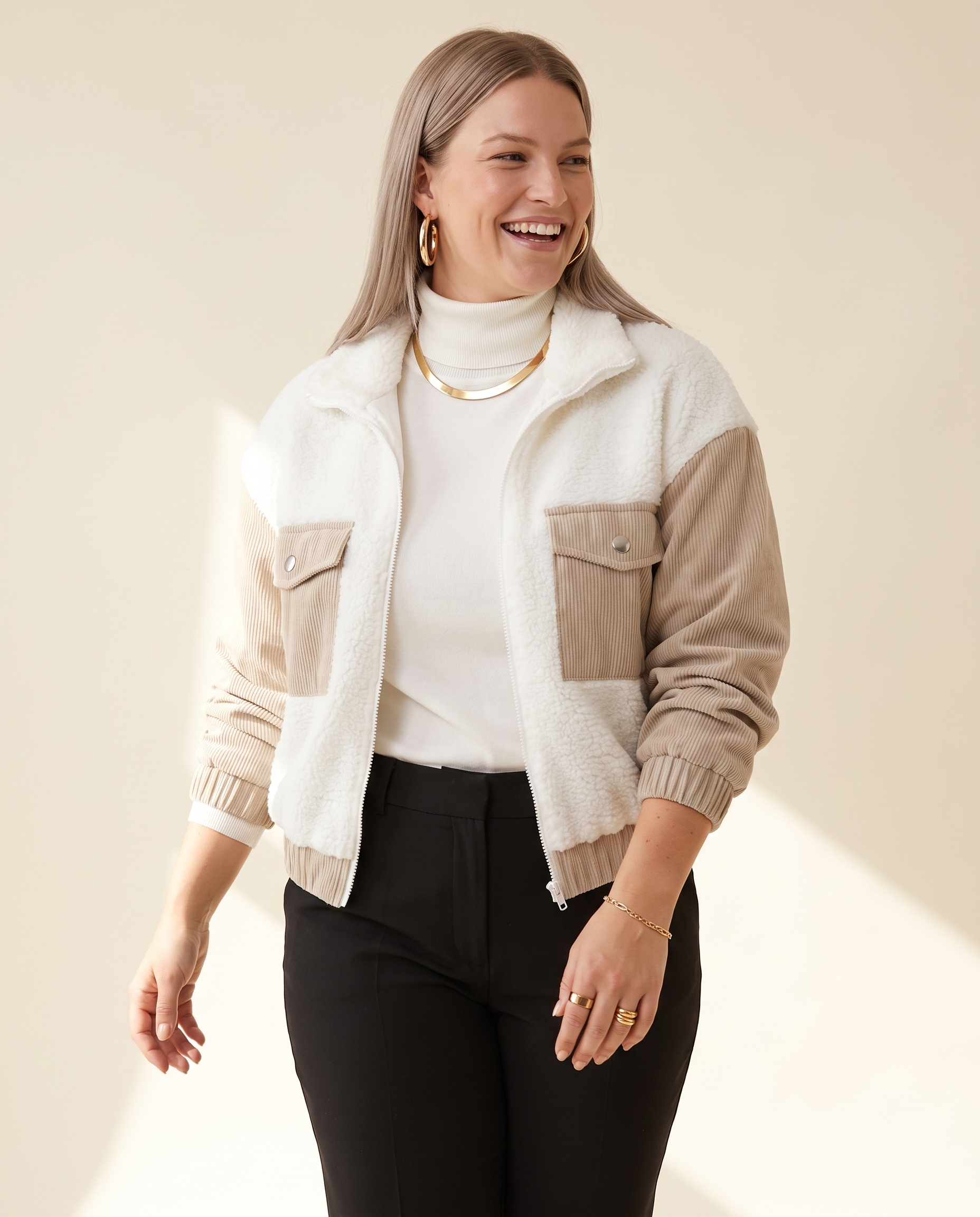 Teddy Panel Jacket — worn by a model against a warm ivory studio backdrop