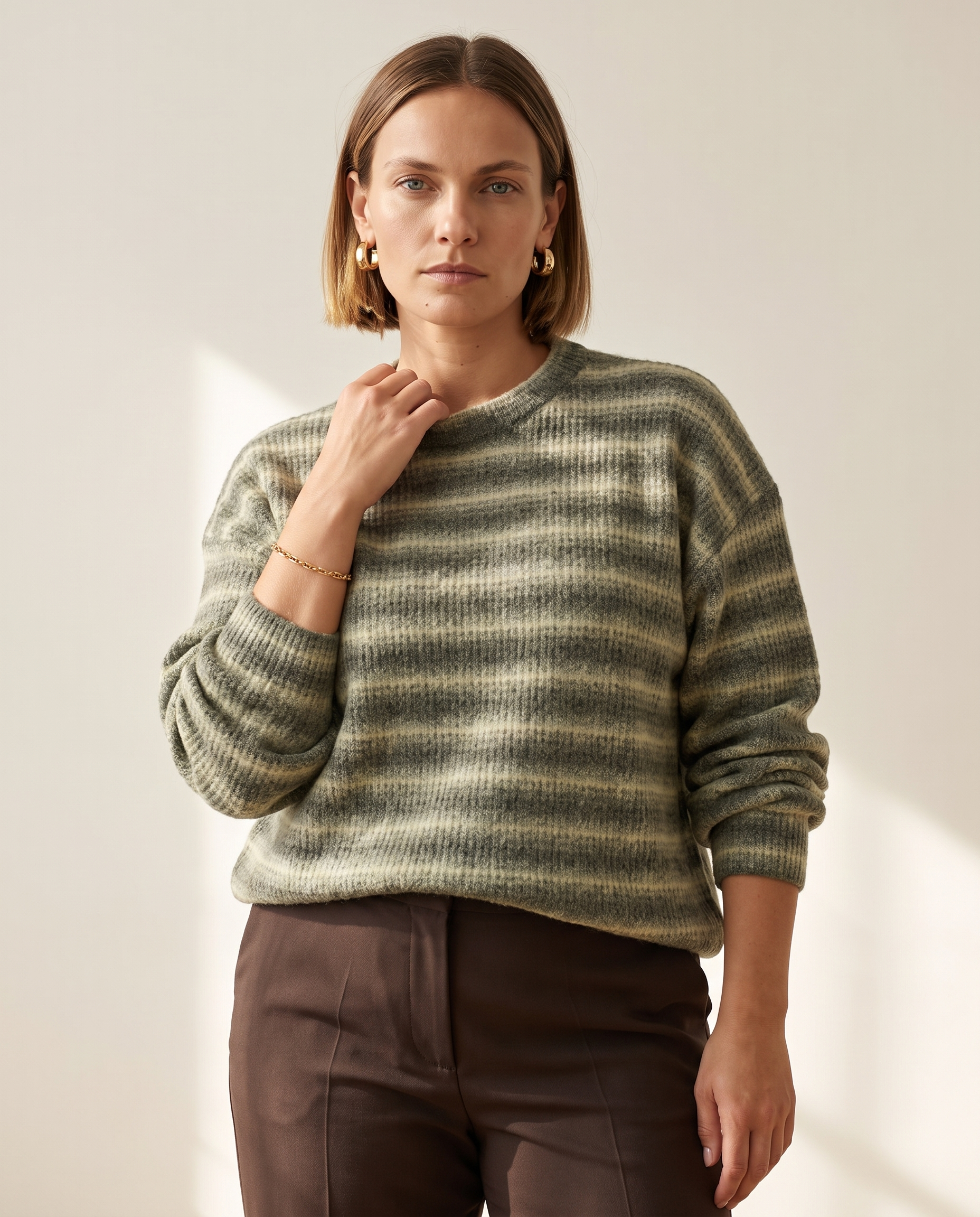 Soft Stripe Crewneck — worn by a model against a warm off-white studio backdrop