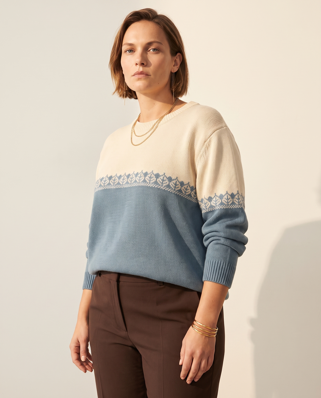 Colourblock Nordic Sweater — three-quarter view, on a warm off-white studio backdrop