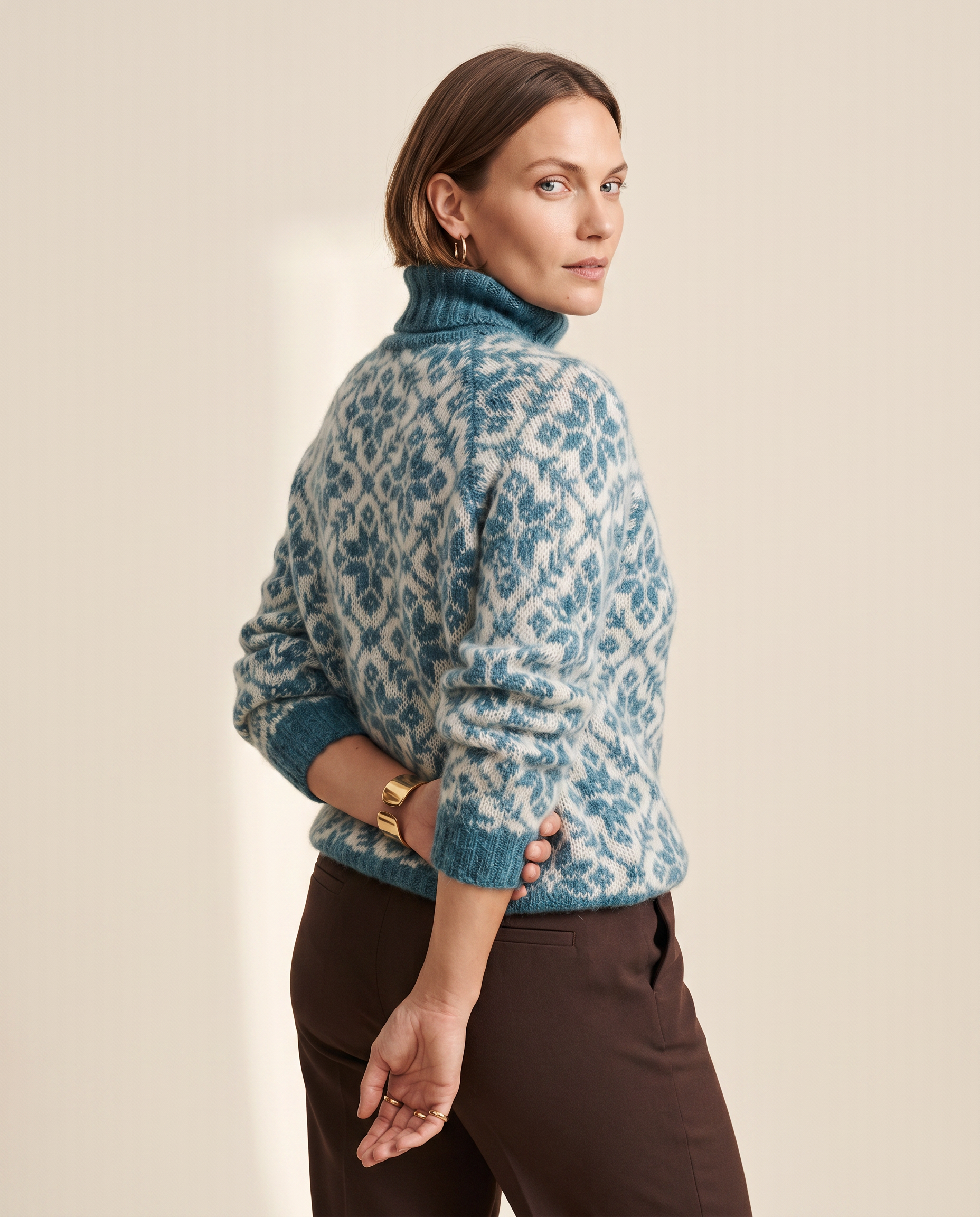 Damask Roll Neck — three-quarter view, on a pale sand studio backdrop