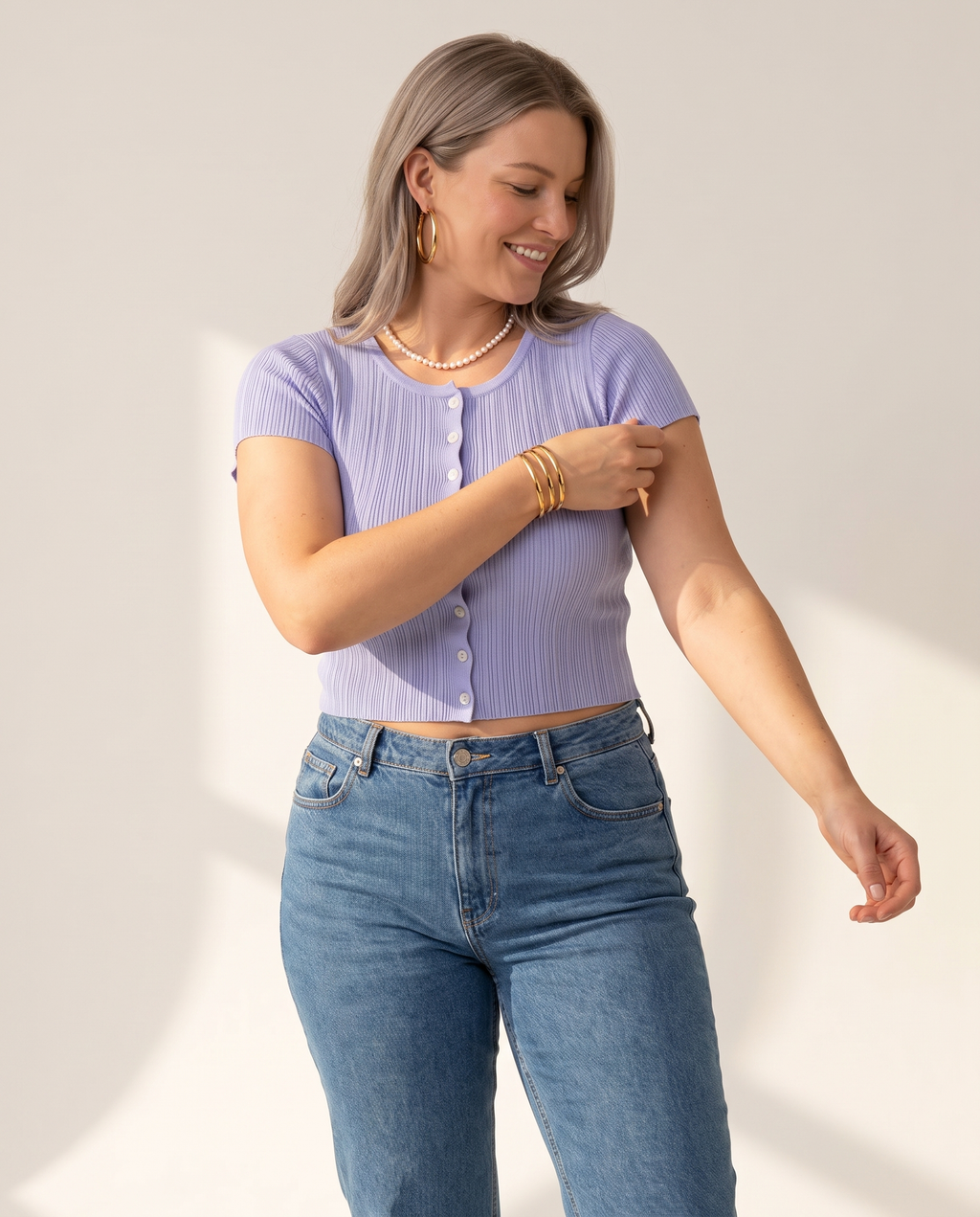 Ribbed Button Top — three-quarter view, on a warm off-white studio backdrop