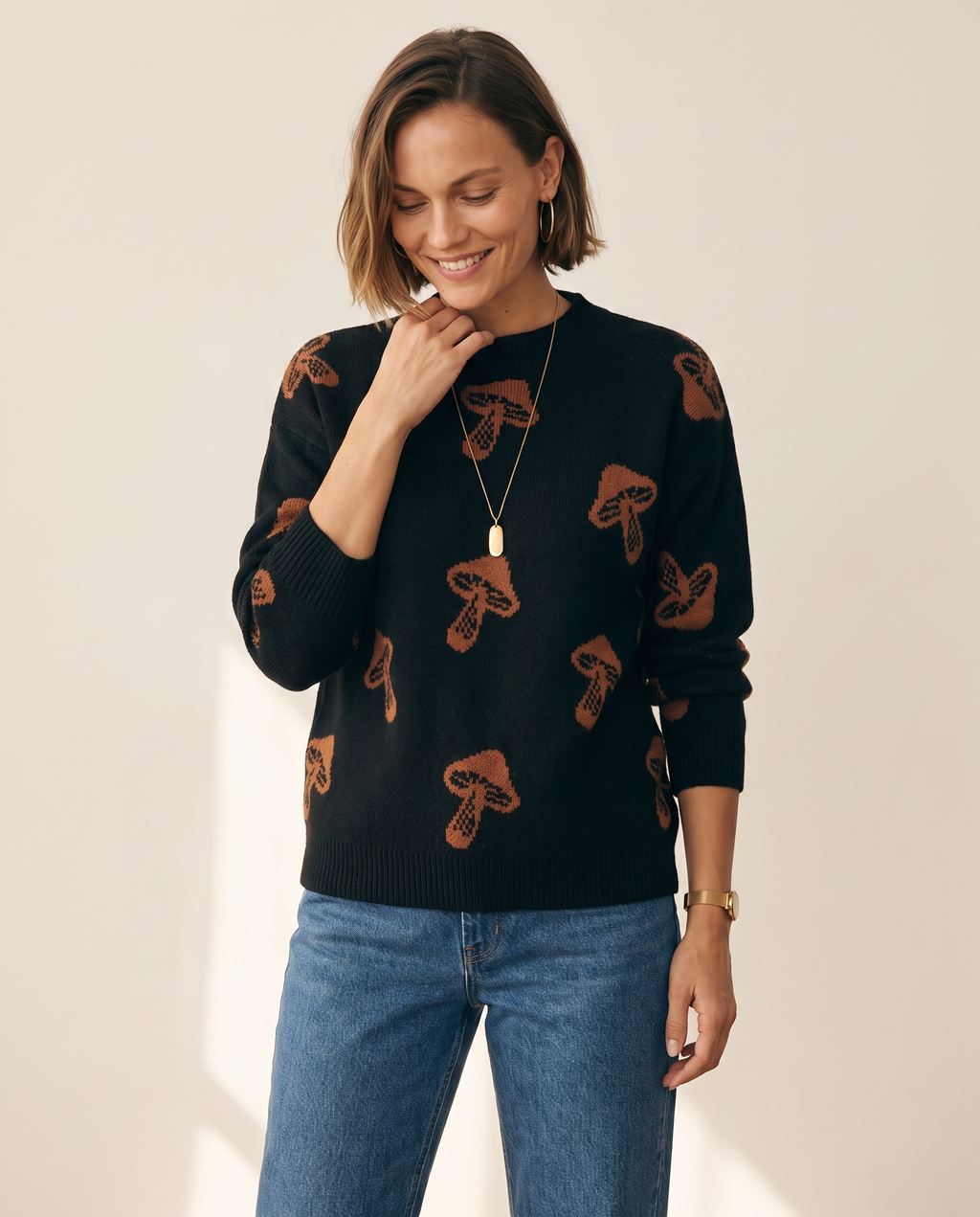 Jacquard Pullover — three-quarter view, on a warm off-white studio backdrop