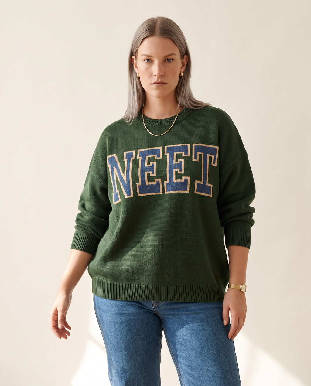 Varsity Knit Top — three-quarter view, on a warm off-white studio backdrop