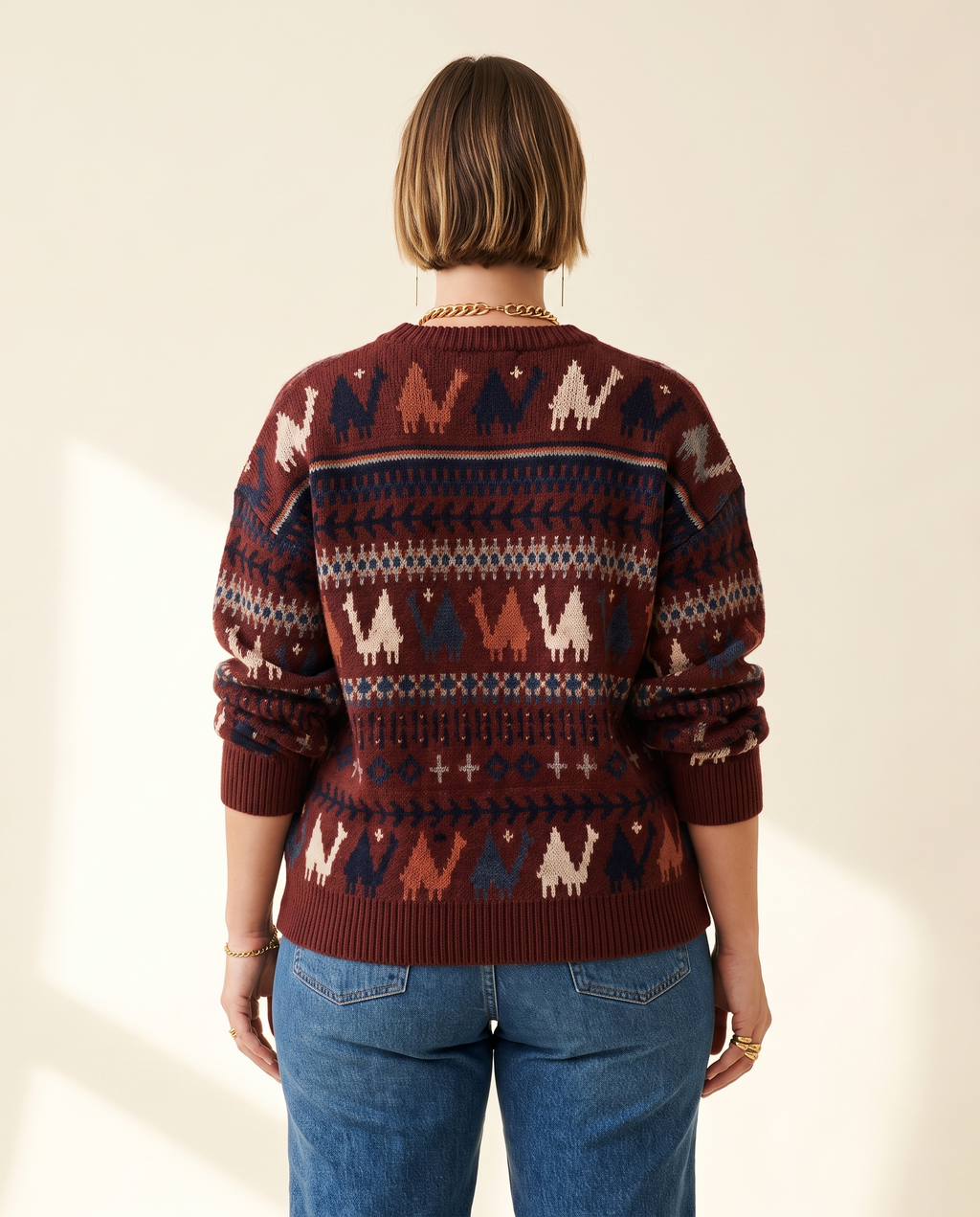 Folk Pattern Sweater — back view, on a warm ivory studio backdrop