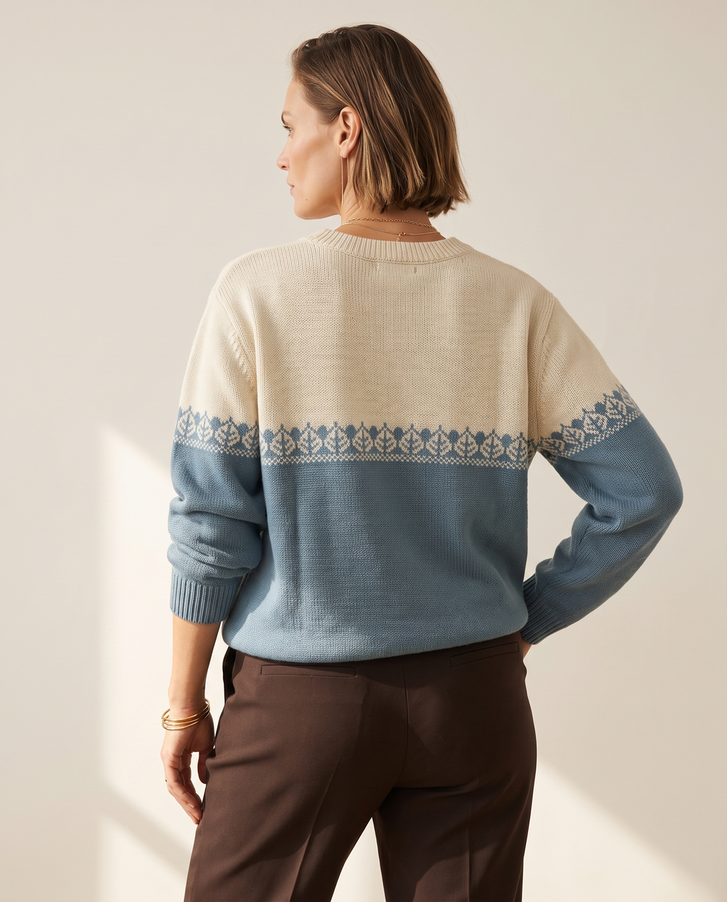 Colourblock Nordic Sweater — back view, on a warm off-white studio backdrop