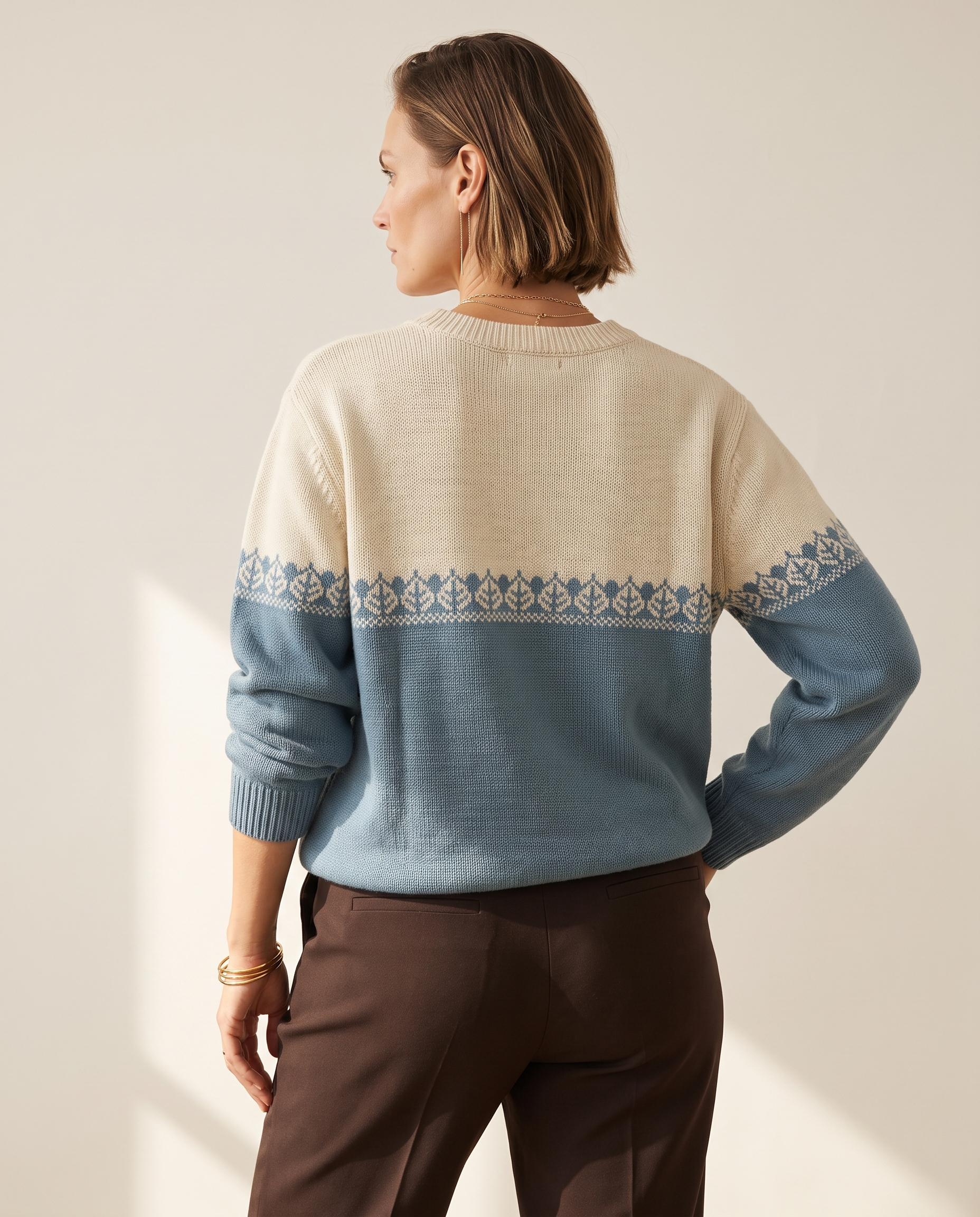 Colourblock Nordic Sweater — back view, on a warm off-white studio backdrop