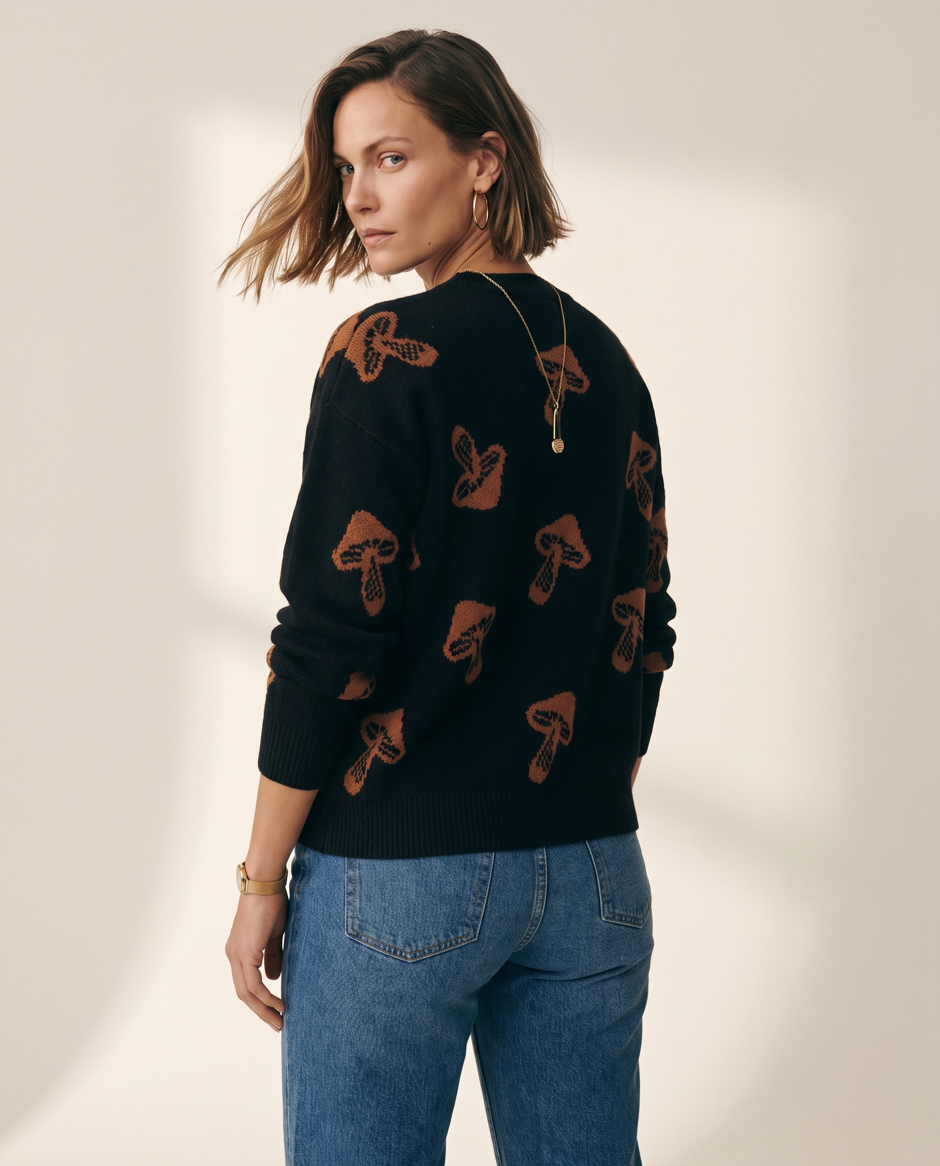Jacquard Pullover — back view, on a warm off-white studio backdrop
