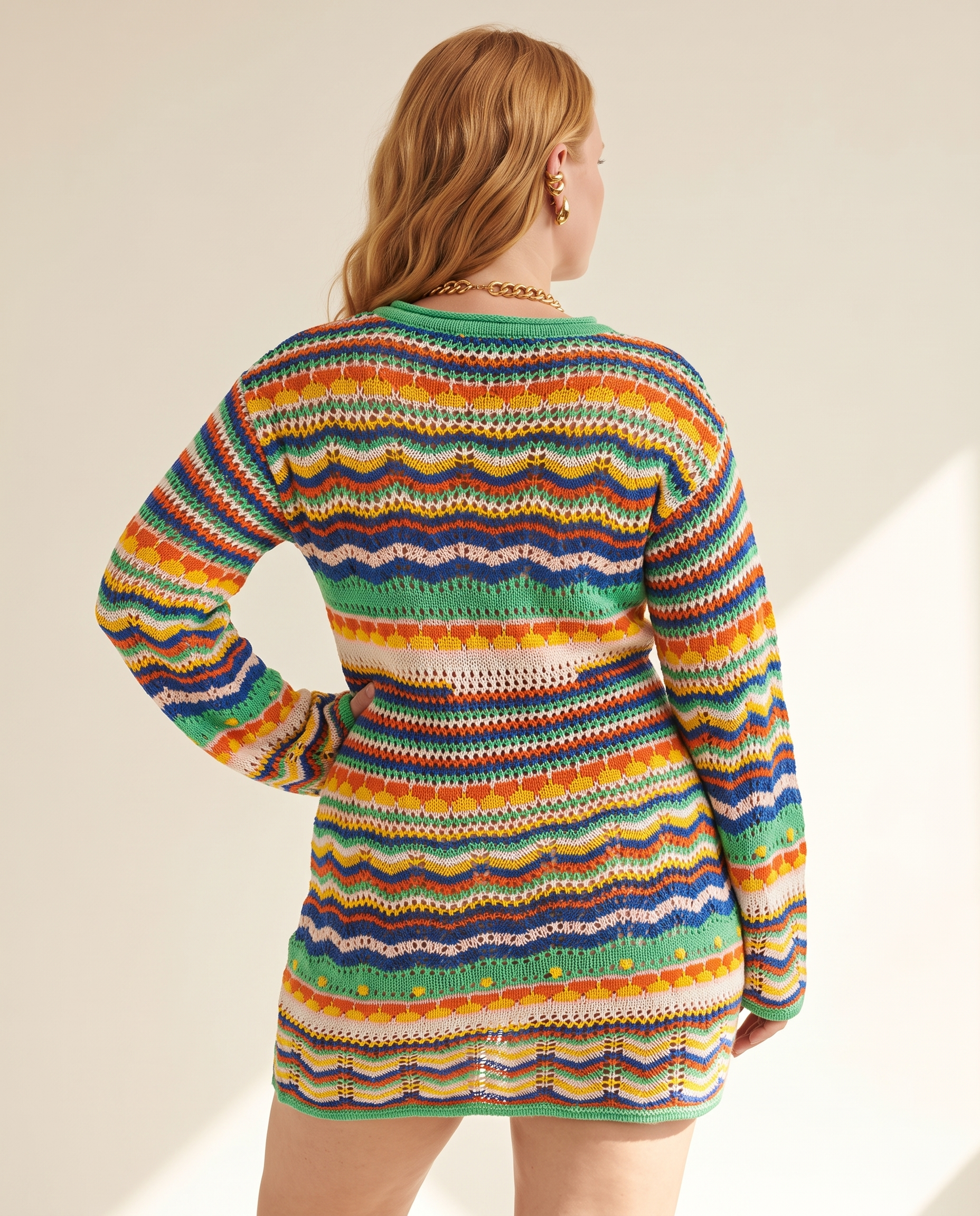 Rainbow Crochet Dress — back view, on a warm off-white studio backdrop
