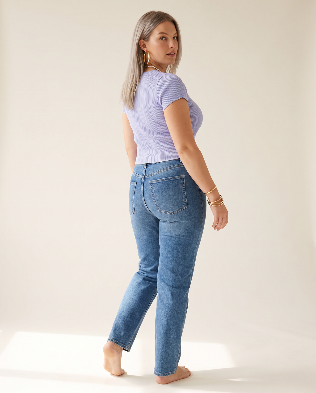 Ribbed Button Top — back view, on a warm off-white studio backdrop