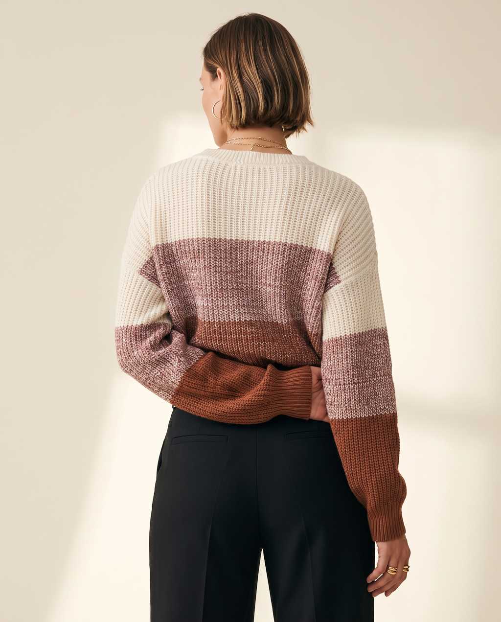 Rose Colourblock Sweater — back view, on a warm ivory studio backdrop
