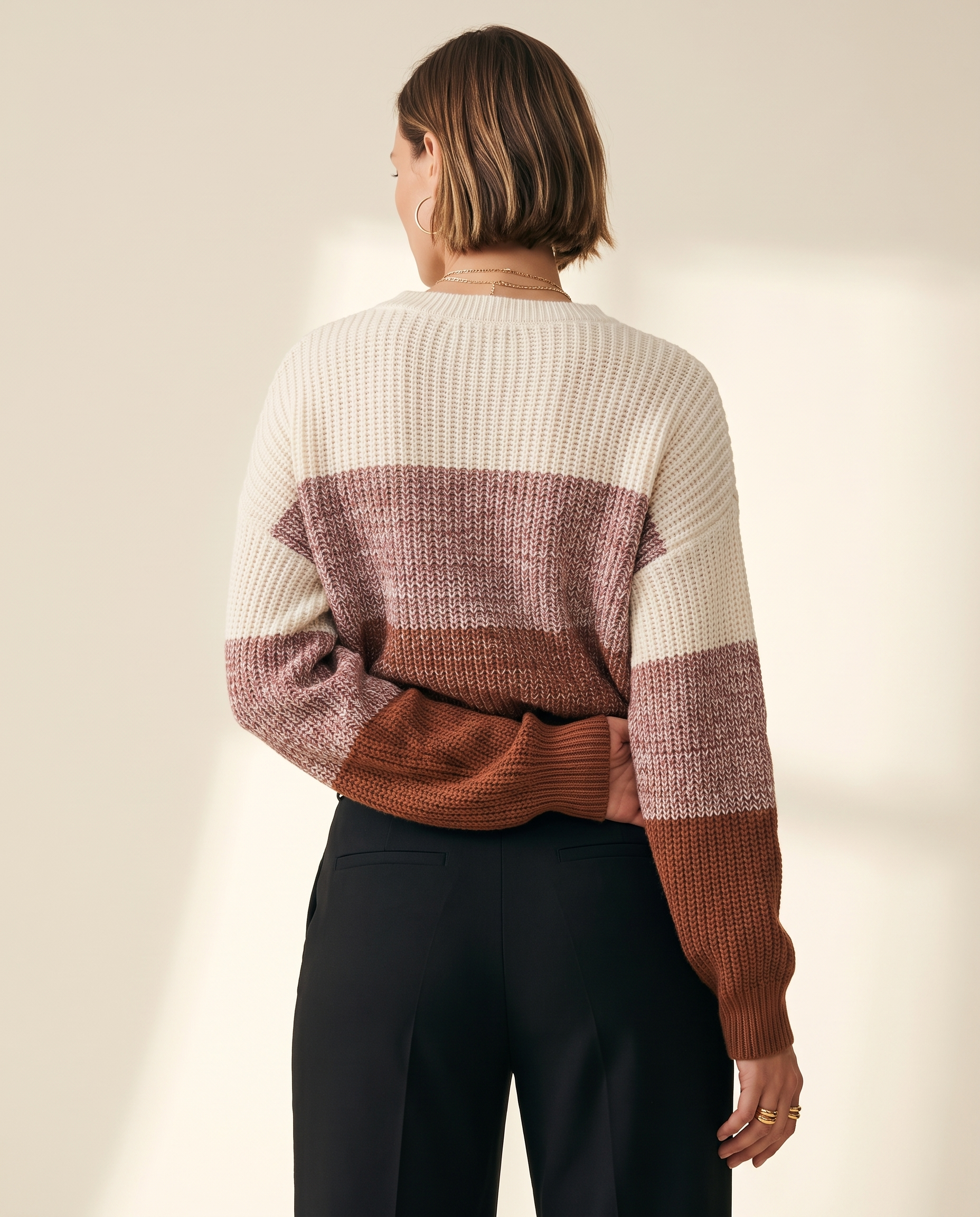 Rose Colourblock Sweater — back view, on a warm ivory studio backdrop