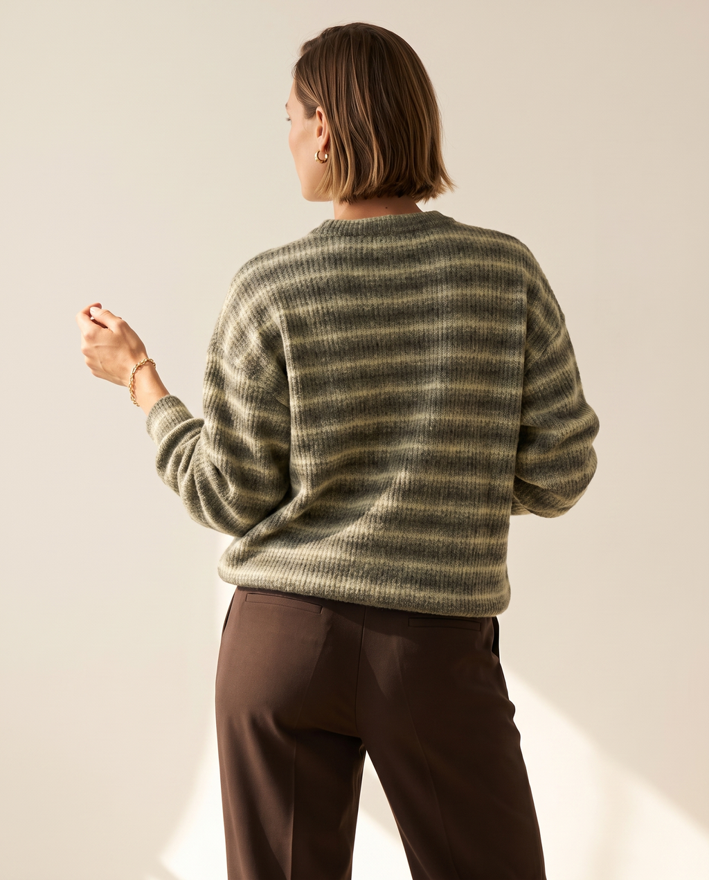 Soft Stripe Crewneck — back view, on a warm off-white studio backdrop