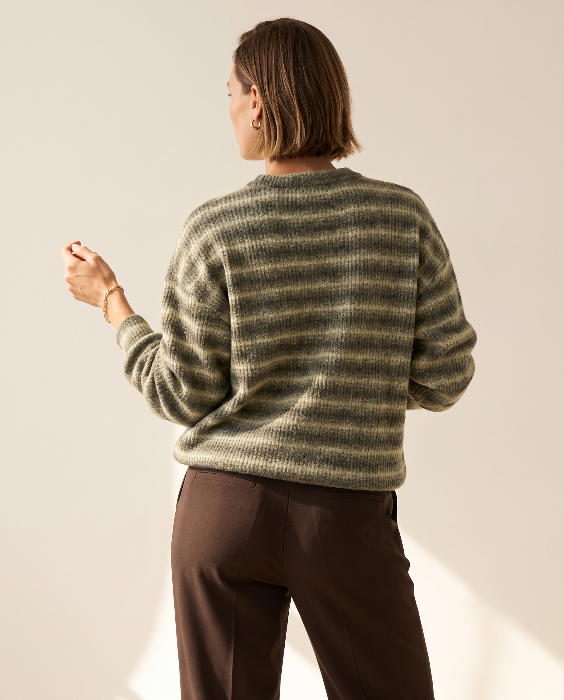 Soft Stripe Crewneck — back view, on a warm off-white studio backdrop