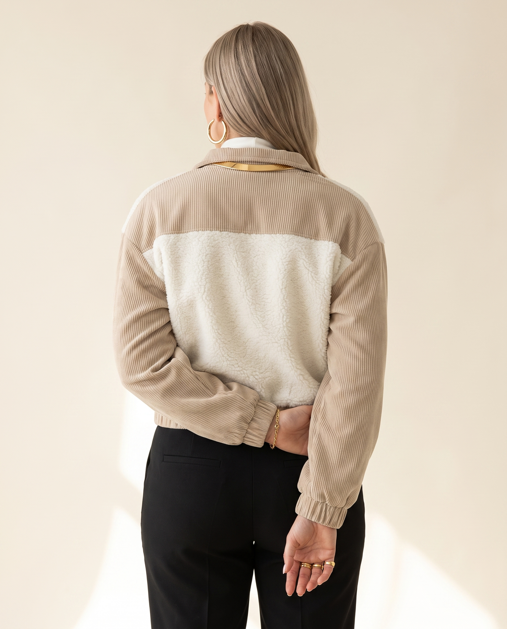 Teddy Panel Jacket — back view, on a warm ivory studio backdrop