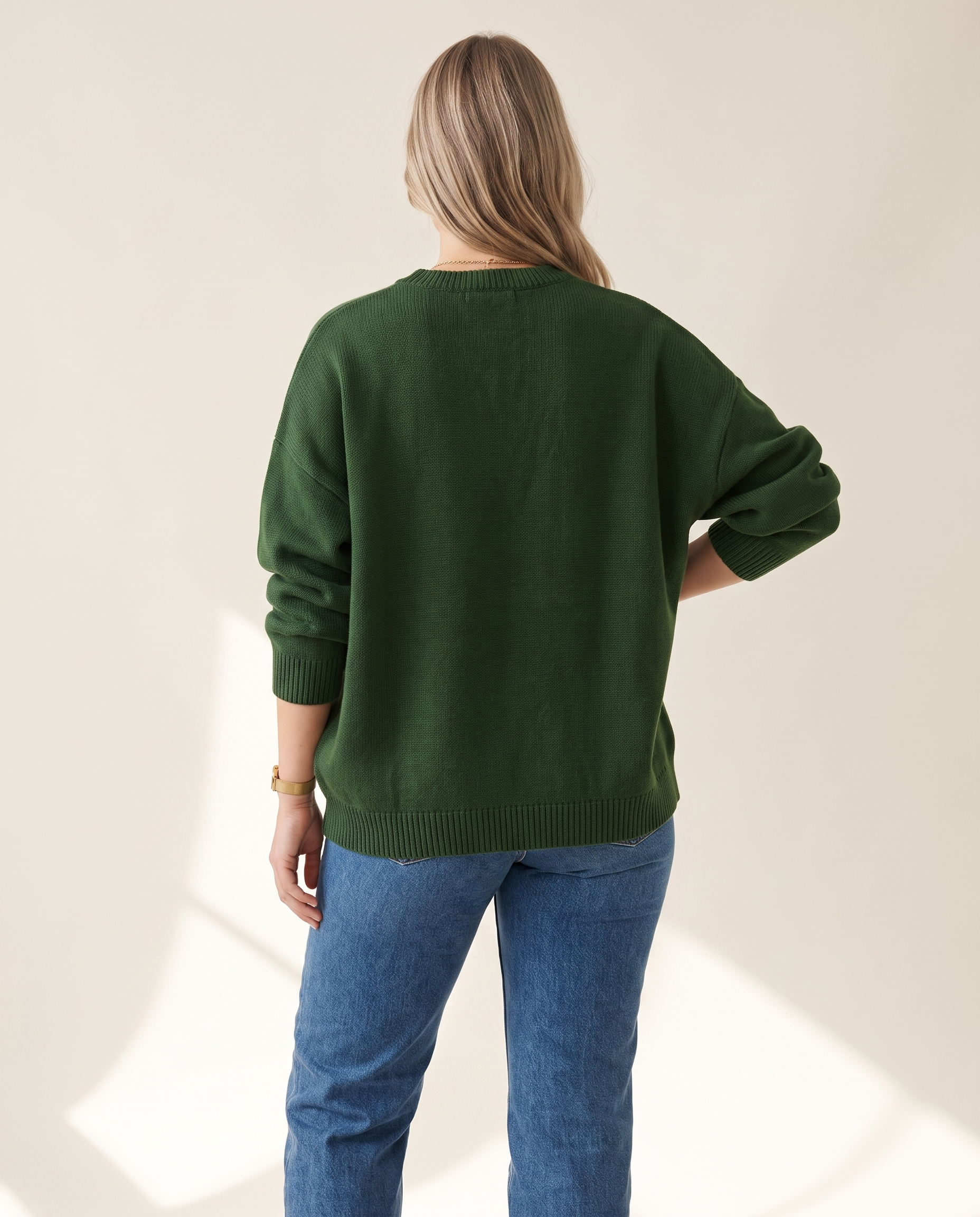 Varsity Knit Top — back view, on a warm off-white studio backdrop