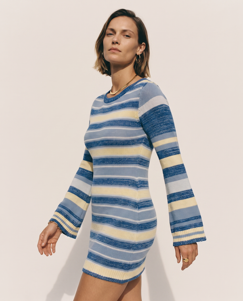 Bell Sleeve Knit Dress — three-quarter view, on a soft off-white studio backdrop