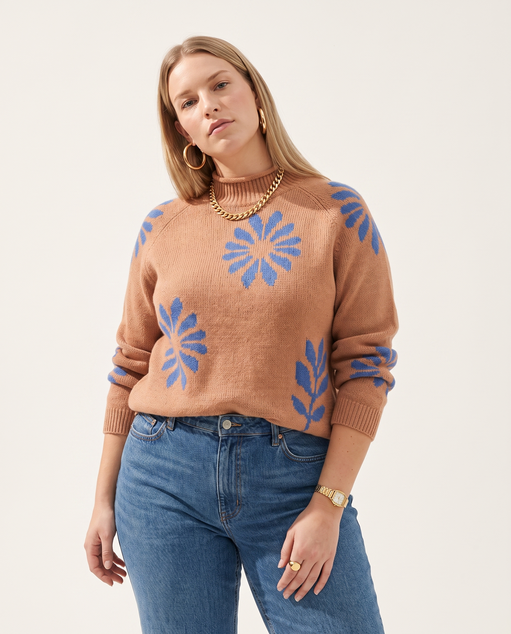 Daisy Knit Sweater — three-quarter view, on a soft off-white studio backdrop