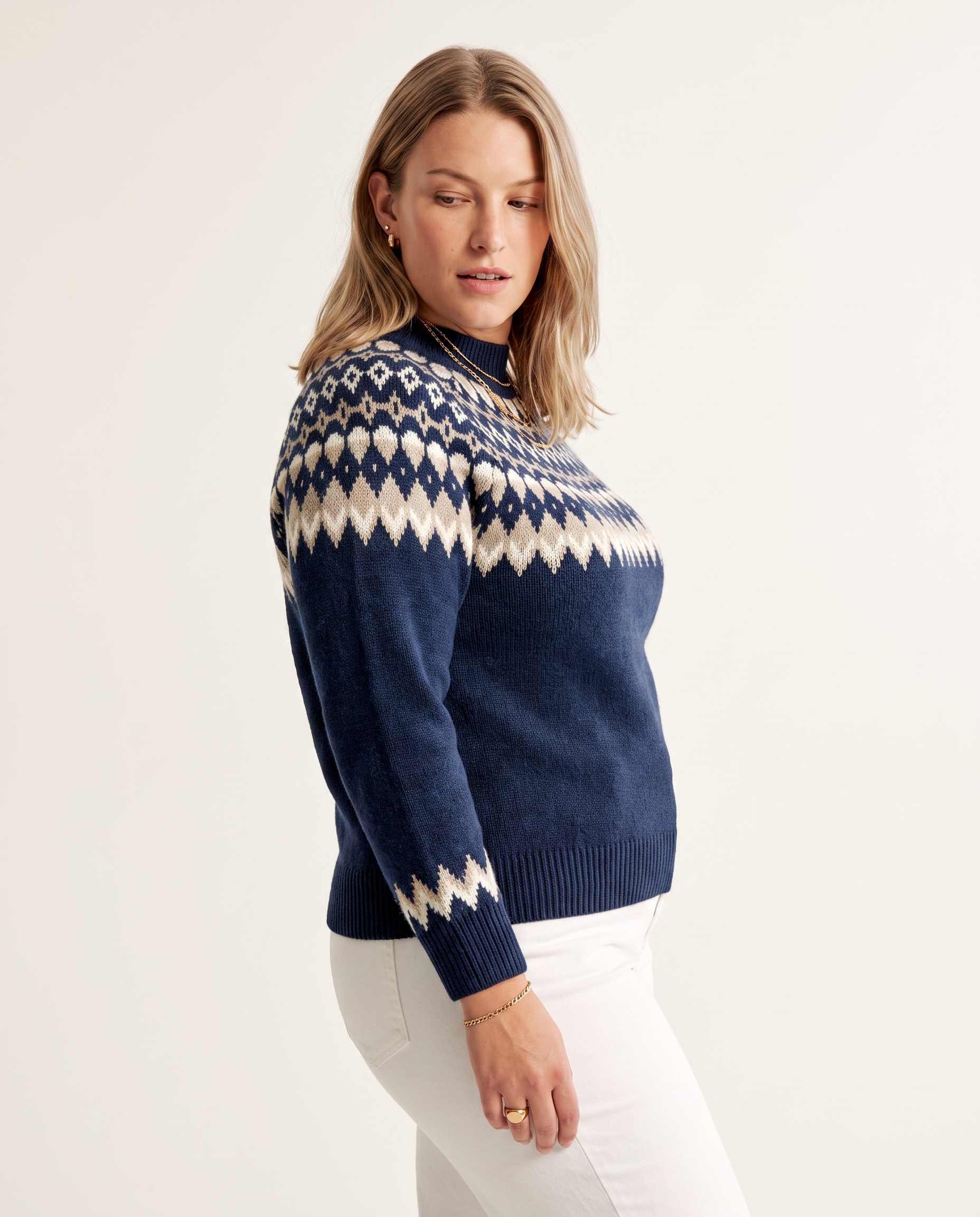 Nordic Diamond Sweater — three-quarter view, on a soft off-white studio backdrop