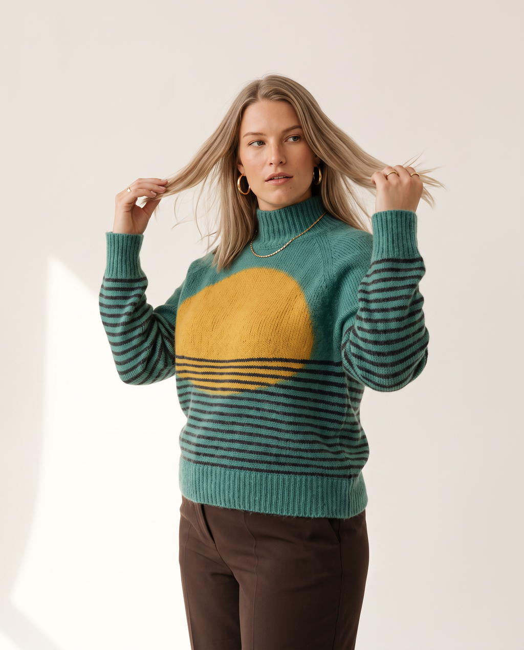 Horizon Sweater — three-quarter view, on a soft off-white studio backdrop