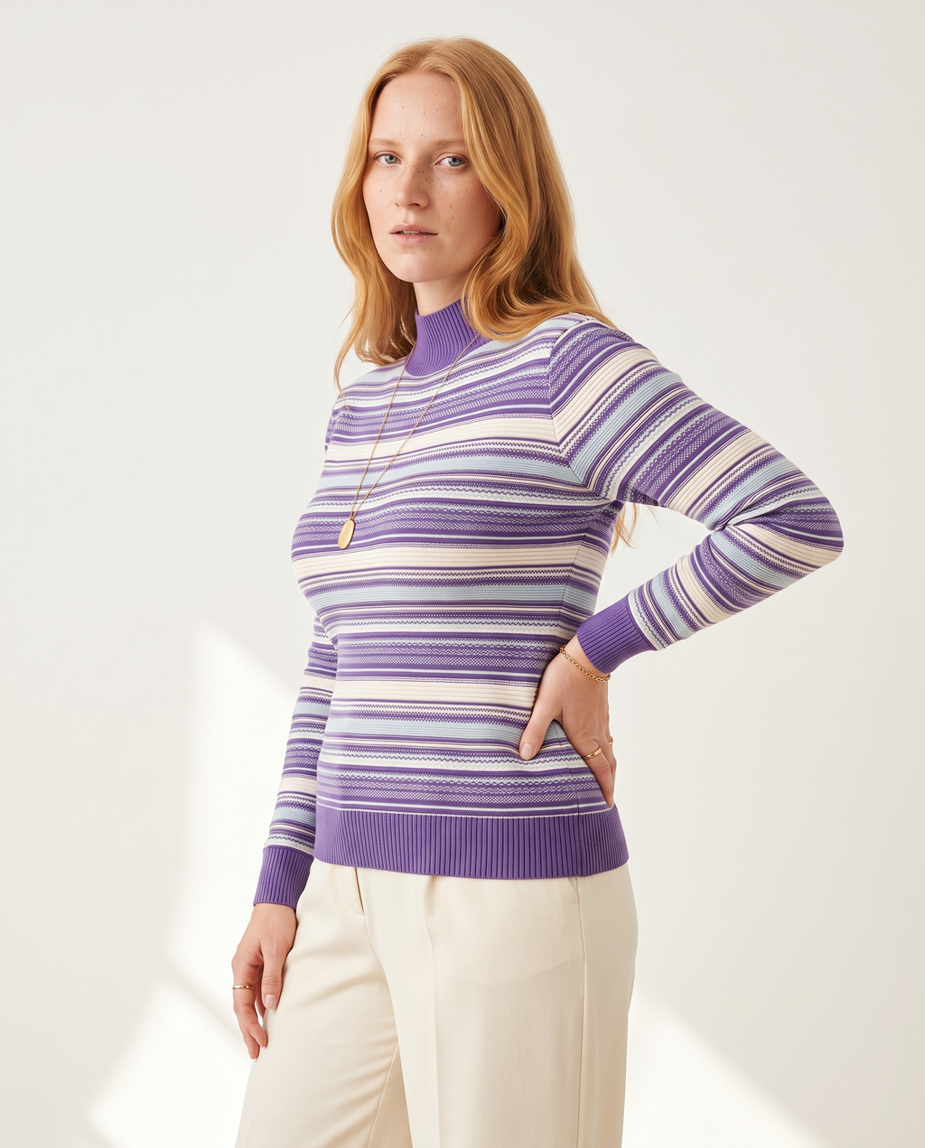 Rib Stripe Mock Neck — three-quarter view, on a soft off-white studio backdrop