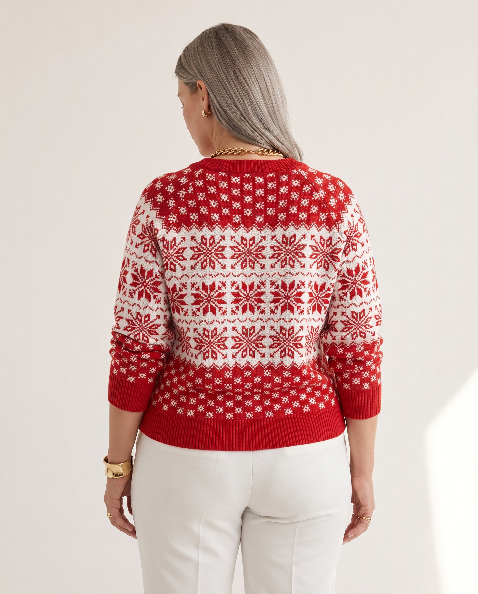 Snowflake Sweater — back view, on a soft off-white studio backdrop