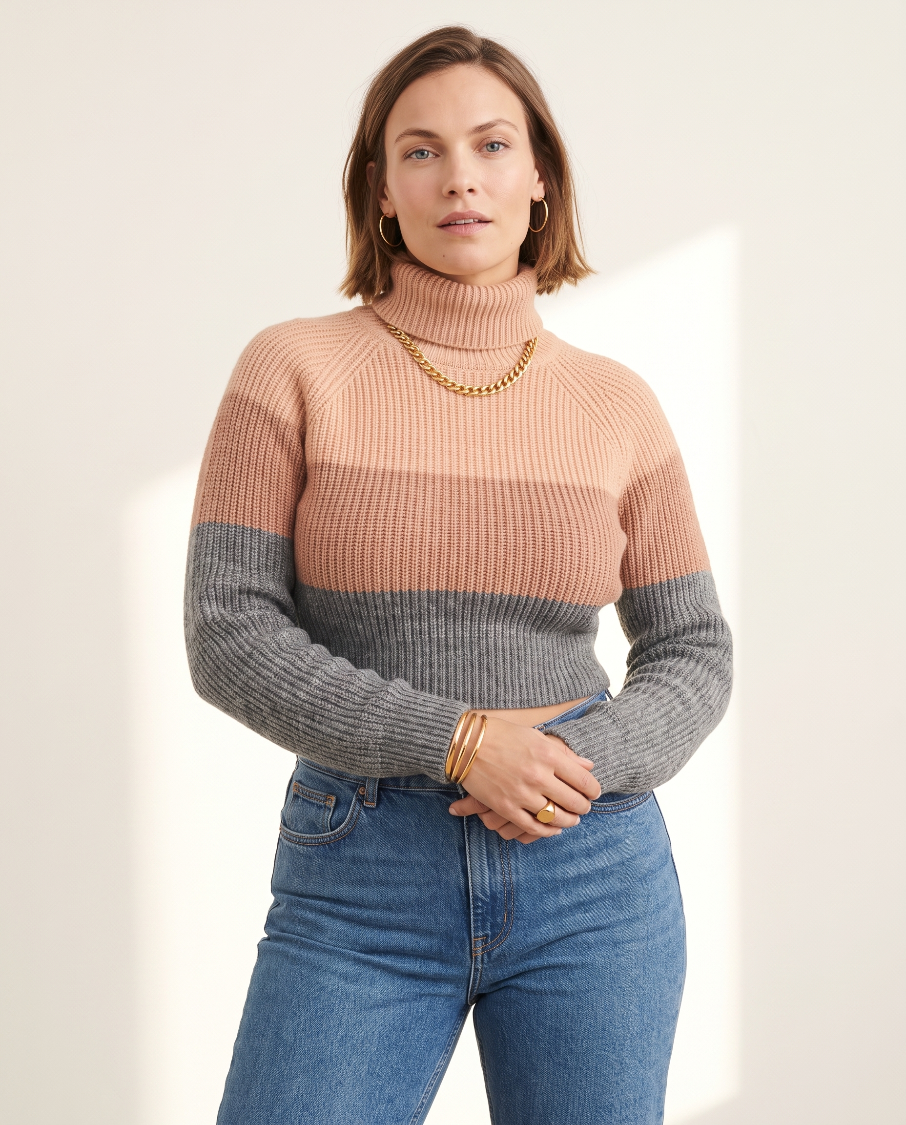 Three-Tone Roll Neck, on a soft off-white studio backdrop