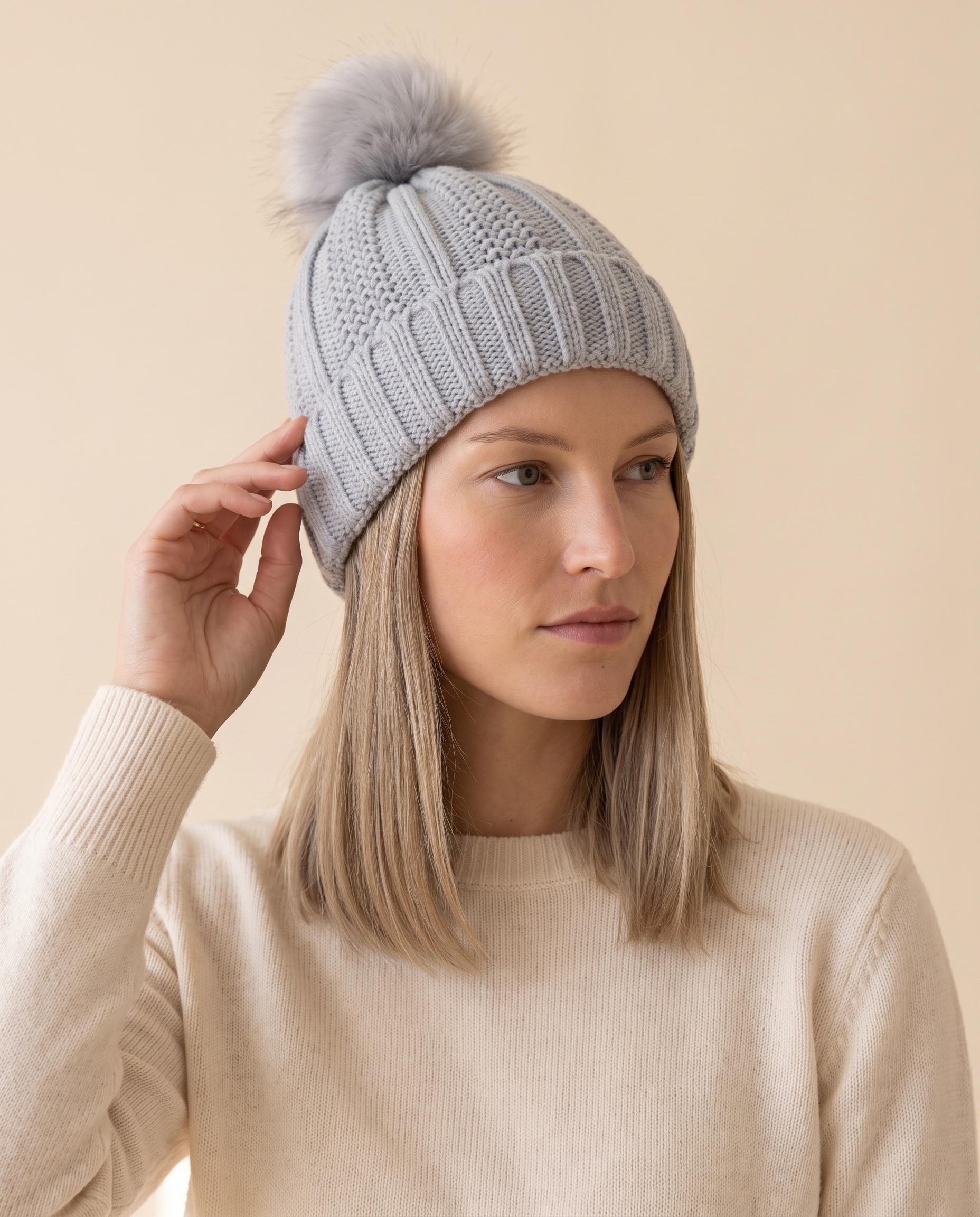 Satin-Lined Cable Beanie on a pale sand studio backdrop