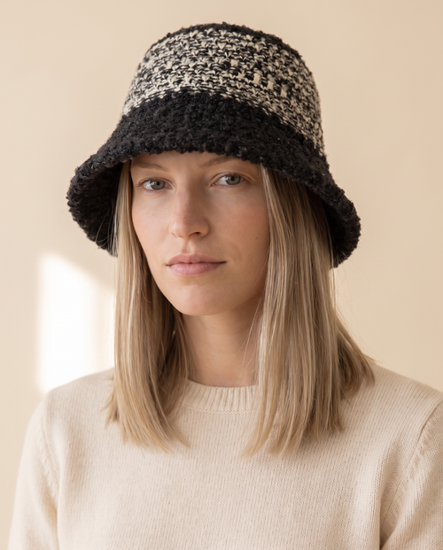 Bouclé Bucket Hat on a pale sand studio backdrop