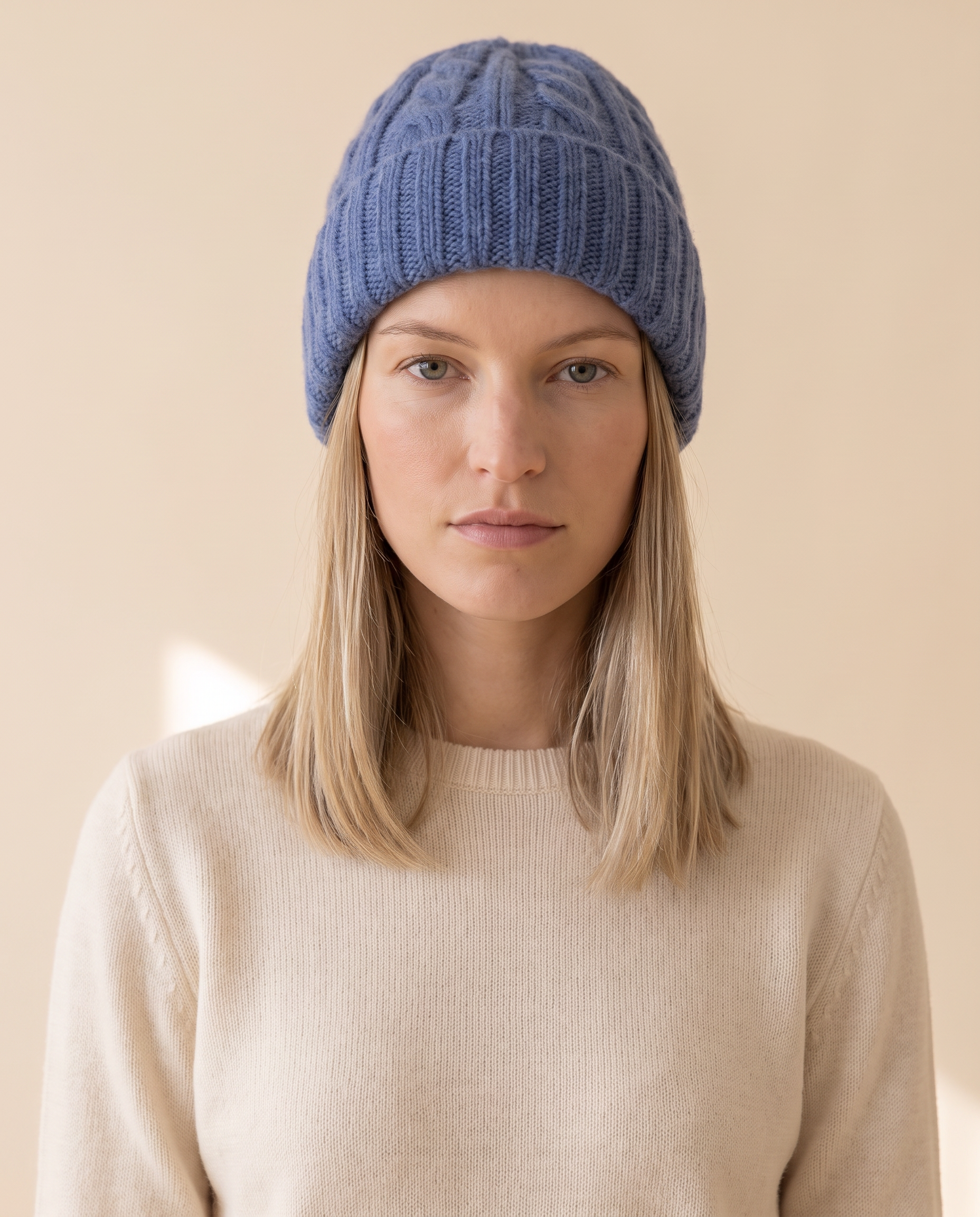 Ribbed Beanie on a pale sand studio backdrop