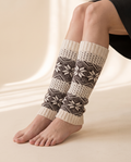 Snowflake Leg Warmers on a pale sand studio backdrop